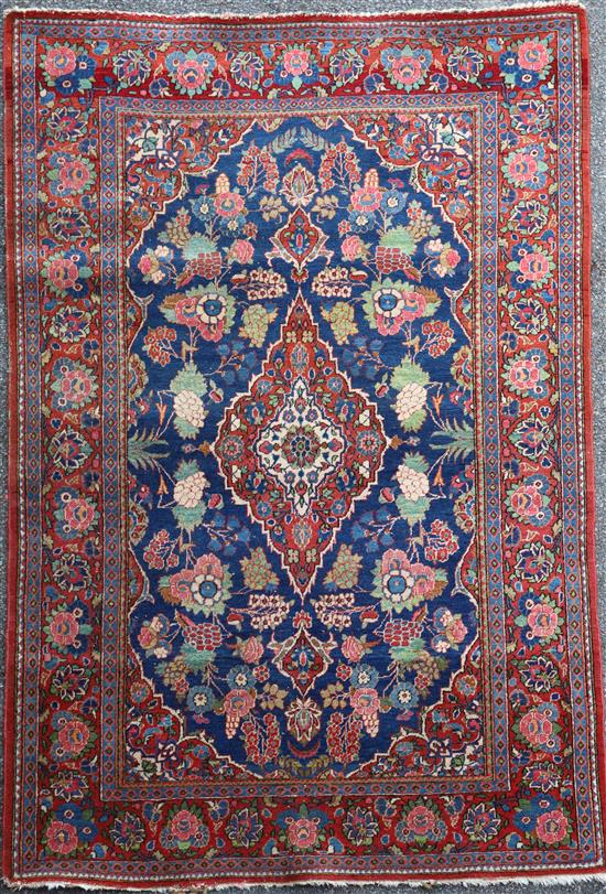 A Kashan blue ground rug, 6ft 8in by 4ft 5in.